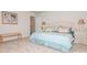Comfortable bedroom featuring a tufted headboard, neutral carpet, and calming decor at 4024 Whipcord Dr, Waxhaw, NC 28173