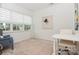 Inviting home office featuring a large window and a cozy reading nook with a patterned armchair at 4024 Whipcord Dr, Waxhaw, NC 28173