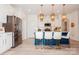 Modern kitchen with white cabinets, stainless steel appliances, and an island with seating at 4024 Whipcord Dr, Waxhaw, NC 28173