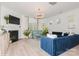 Modern living room with a fireplace, stylish furniture, and ample natural light, creating a cozy and inviting atmosphere at 4024 Whipcord Dr, Waxhaw, NC 28173
