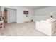 Open loft area with neutral carpet, a white cabinet, and comfortable seating, perfect for relaxation at 4024 Whipcord Dr, Waxhaw, NC 28173