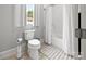 Bathroom with shower-tub combo, tiled floors, and a window at 4025 Foxes Trl, Cramerton, NC 28032