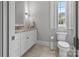 Bathroom featuring granite countertop vanity and modern toilet at 4025 Foxes Trl, Cramerton, NC 28032