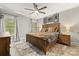 Bedroom with a plush rug, ceiling fan, and natural light at 4025 Foxes Trl, Cramerton, NC 28032
