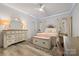Bedroom with modern ceiling fan, white dresser, and natural light at 4025 Foxes Trl, Cramerton, NC 28032