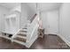 Hallway with a staircase, built-in storage, and hardwood floors at 4025 Foxes Trl, Cramerton, NC 28032