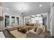 Comfortable living room featuring an open floor plan with hardwood floors and neutral décor at 4025 Foxes Trl, Cramerton, NC 28032