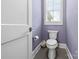 Powder room with window and modern toilet at 4025 Foxes Trl, Cramerton, NC 28032