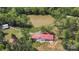 Gorgeous aerial view of a home next to a pond surrounded by lush trees at 4205 Cahnnas Way, Waxhaw, NC 28173