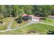 Spacious home with a red roof, an extended driveway, and a large front yard at 4205 Cahnnas Way, Waxhaw, NC 28173