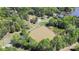 Expansive property with a large pond, surrounded by lush greenery at 4205 Cahnnas Way, Waxhaw, NC 28173
