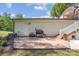 Backyard deck with white siding, grill, stairs, landscaping and a lawn at 4205 Cahnnas Way, Waxhaw, NC 28173