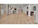 Open basement with wood flooring, a sewing machine desk, and stairs leading to another level at 4205 Cahnnas Way, Waxhaw, NC 28173