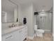 Bathroom featuring a glass enclosed shower, vanity with marble countertop and a modern mirror at 4205 Cahnnas Way, Waxhaw, NC 28173