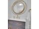 Stylish bathroom vanity with a unique mirror and modern fixtures at 4205 Cahnnas Way, Waxhaw, NC 28173