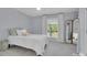 Cozy bedroom featuring a large window, neutral decor, and soft carpet at 4205 Cahnnas Way, Waxhaw, NC 28173