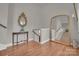 Foyer with hardwood floors, staircase, large mirror and decorative accents at 4205 Cahnnas Way, Waxhaw, NC 28173