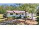 Charming white brick home with a red roof and well-manicured landscaping at 4205 Cahnnas Way, Waxhaw, NC 28173