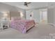 Inviting main bedroom featuring carpet, a ceiling fan, and two closets at 4205 Cahnnas Way, Waxhaw, NC 28173