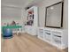 Bright playroom with a desk, bookcase, storage unit, and a large mirror at 4205 Cahnnas Way, Waxhaw, NC 28173