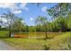 Scenic pond with trees and a small boat on a sunny day at 4205 Cahnnas Way, Waxhaw, NC 28173