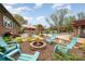 Backyard featuring a fire pit with chairs, pool, patio, and landscaped yard at 424 Mirror Lake Rd, Salisbury, NC 28146
