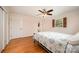 Bedroom with a ceiling fan, wood floor, and access to the bathroom at 424 Mirror Lake Rd, Salisbury, NC 28146