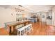 Open-concept dining area leading to a modern kitchen and a comfortable living room at 424 Mirror Lake Rd, Salisbury, NC 28146
