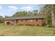 Charming brick ranch-style home with a well-manicured lawn and inviting curb appeal at 424 Mirror Lake Rd, Salisbury, NC 28146