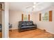 Bright living room features a ceiling fan, windows with wood shutters, and comfortable seating at 424 Mirror Lake Rd, Salisbury, NC 28146