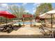 Inviting backyard oasis featuring a sparkling pool, pergola, and patio furniture perfect for outdoor entertaining at 424 Mirror Lake Rd, Salisbury, NC 28146