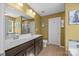 Bathroom featuring double sinks, granite countertops, and a large mirror at 428 Winecoff Woods Nw Dr, Concord, NC 28027
