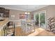 Bright dining area with a sliding glass door to the patio, a chandelier, and stylish decor at 428 Winecoff Woods Nw Dr, Concord, NC 28027