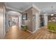 Spacious entryway featuring hardwood floors, an arched entryway, and access to the kitchen and outdoor area at 428 Winecoff Woods Nw Dr, Concord, NC 28027