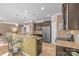 Well-equipped kitchen featuring granite countertops, stainless steel appliances, ample cabinet space, and a breakfast bar at 428 Winecoff Woods Nw Dr, Concord, NC 28027