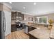 Well-equipped kitchen boasts stainless appliances, granite counters, and opens to a bright dining area at 428 Winecoff Woods Nw Dr, Concord, NC 28027