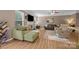 Cozy living room with a fireplace, plush seating, hardwood floors, and lots of natural light at 428 Winecoff Woods Nw Dr, Concord, NC 28027