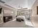 Serene main bedroom boasts tray ceiling, neutral decor, and abundant natural light at 428 Winecoff Woods Nw Dr, Concord, NC 28027