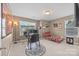 Well-lit office with a large desk, ergonomic chair, bookshelf, and a daybed for relaxation at 428 Winecoff Woods Nw Dr, Concord, NC 28027