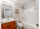 Full bathroom with a shower and tub combo and a dark wooden vanity cabinet and tile floors at 431 Harvest Ter, Lake Wylie, SC 29710