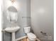 Chic powder room featuring a pedestal sink, tile flooring, and modern fixtures at 431 Harvest Ter, Lake Wylie, SC 29710