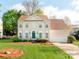 Charming two-story home featuring a well-manicured lawn, a green front door, and an attached two-car garage at 431 Harvest Ter, Lake Wylie, SC 29710