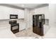 Well-equipped kitchen featuring white cabinets, sleek black appliances, and modern countertops at 431 Harvest Ter, Lake Wylie, SC 29710