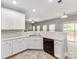 Well-lit kitchen featuring white cabinets, modern appliances, and a seamless transition to the outdoor space at 431 Harvest Ter, Lake Wylie, SC 29710