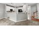 Stylish kitchen with white cabinets, black appliances, and a convenient breakfast bar at 431 Harvest Ter, Lake Wylie, SC 29710