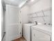 A laundry room with white appliances and wire shelving at 431 Harvest Ter, Lake Wylie, SC 29710