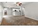 Open-concept living area showcasing neutral walls, carpeting, and seamless flow into the kitchen at 431 Harvest Ter, Lake Wylie, SC 29710