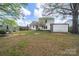 Large backyard with shed, patio area, and mature tree coverage at 4700 Aldersbrook Dr, Monroe, NC 28110