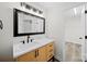 Renovated bathroom with modern fixtures, updated flooring, and access to closet at 4700 Aldersbrook Dr, Monroe, NC 28110