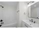 This bathroom features a tub-shower combo, a single sink vanity, and matte black fixtures at 4700 Aldersbrook Dr, Monroe, NC 28110